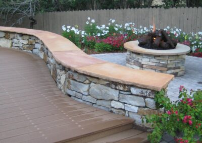 Siloam Stone Seating Wall | Fire Pit | Metal Logs | Plantings | Pavers