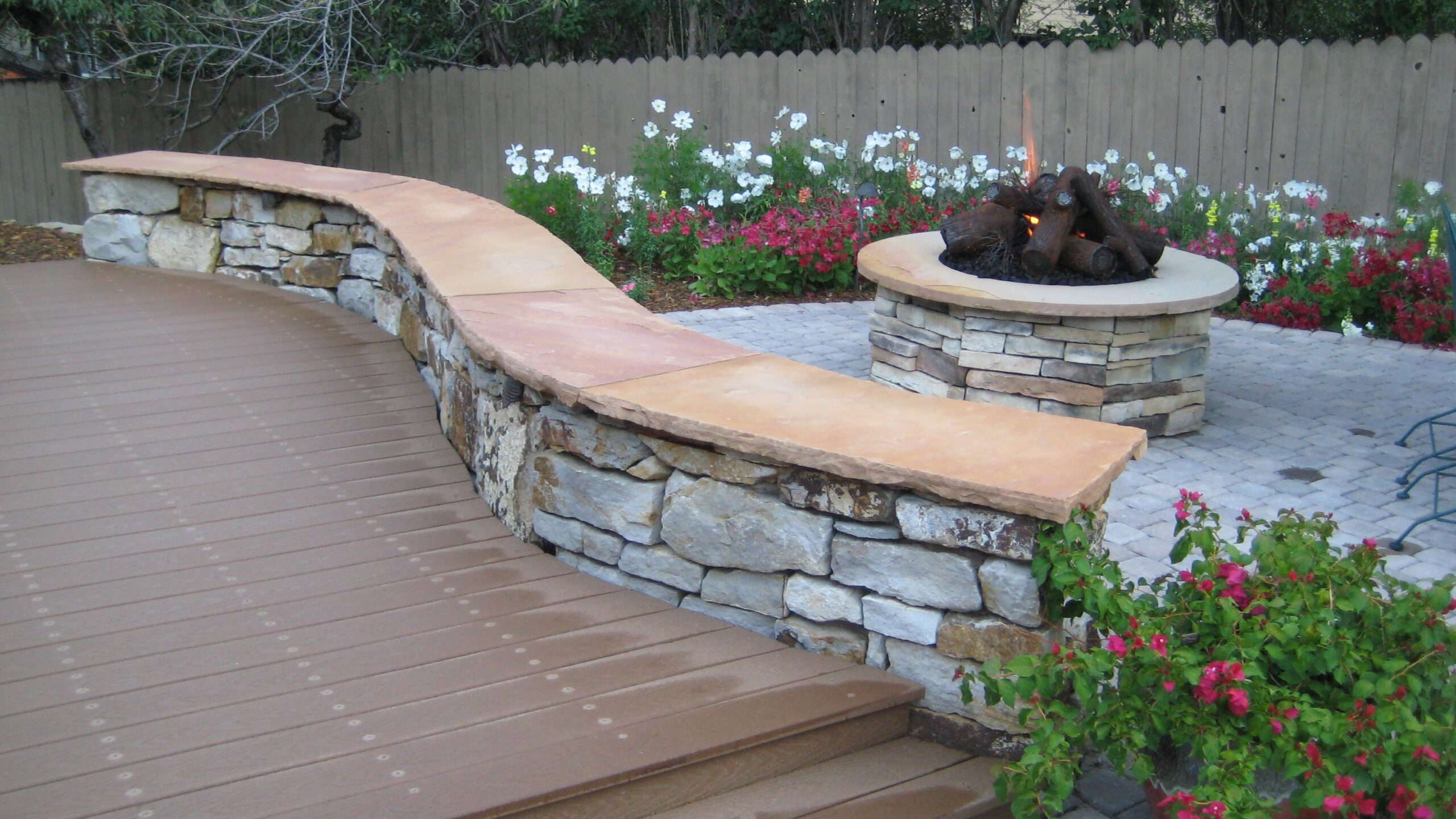 Siloam Stone Seating Wall | Fire Pit | Metal Logs | Plantings | Pavers
